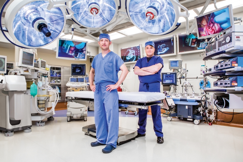 Doctors Kulik and Cartledge standing together in the operating room